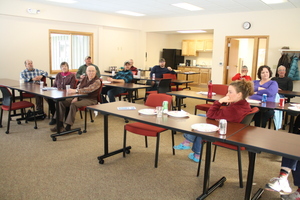 Conference Room at TLS with people at tables