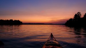 Photo of sunset in front of kayak