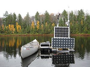 Photo of canoe moored to buoys